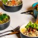 A vibrant assortment of healthy bowls and drinks showcasing fresh ingredients like broccoli and citrus.